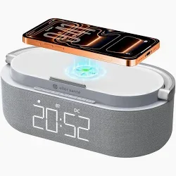 Grey fabric 3-in-1 Bluetooth speaker with a wireless charging top and green clock display.