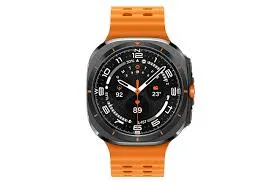 Cushion-shaped titanium smartwatch with orange strap, orange side button and analogue watch face.