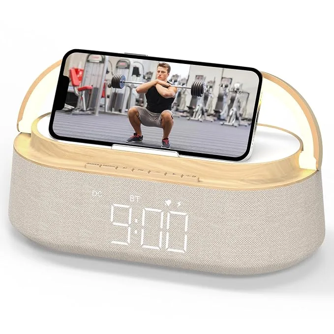 Cream fabric bedside Bluetooth speaker with wireless charging deck, LED clock at 9:00 and night light.